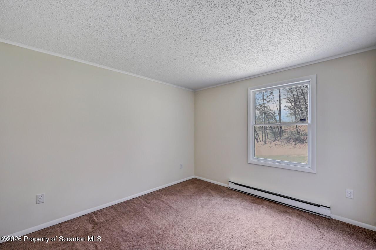 3032 1/2 Division Street Scranton, PA 18504 - Photo 33 of 49 an empty room with a window