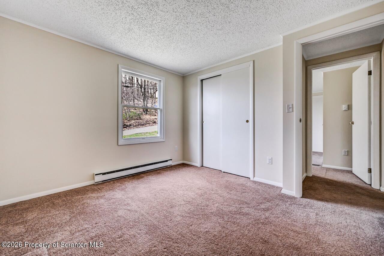 3032 1/2 Division Street Scranton, PA 18504 - Photo 34 of 49 an empty room with windows and closet