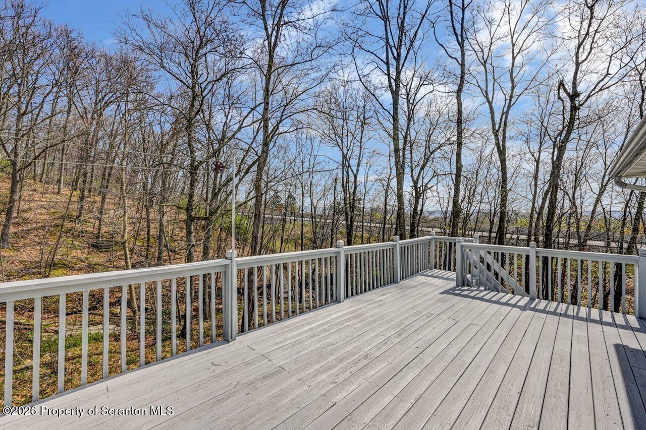 3032 1/2 Division Street Scranton, PA 18504 - Photo 40 of 49 a view of balcony with wooden floor and fence