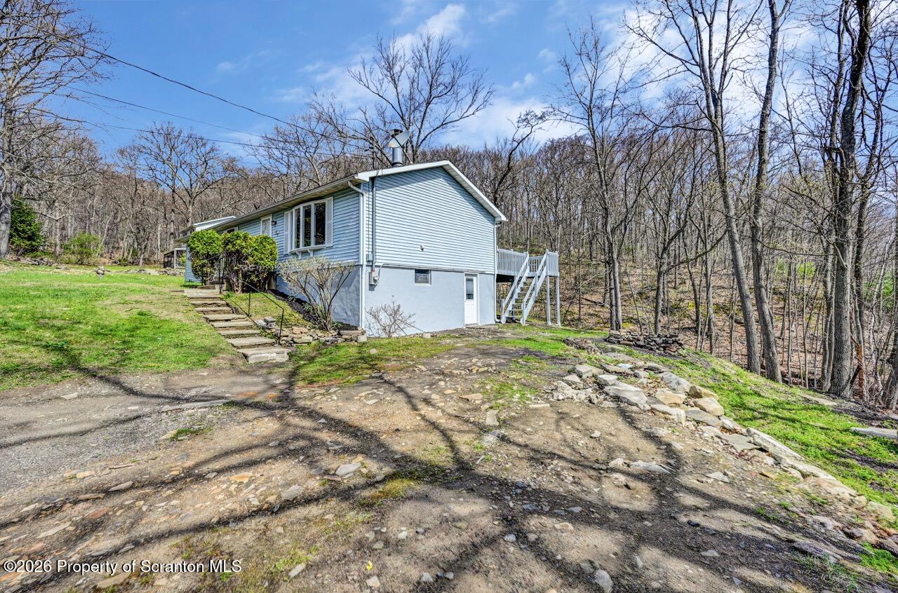 3032 1/2 Division Street Scranton, PA 18504 - Photo 48 of 49 a house with a yard