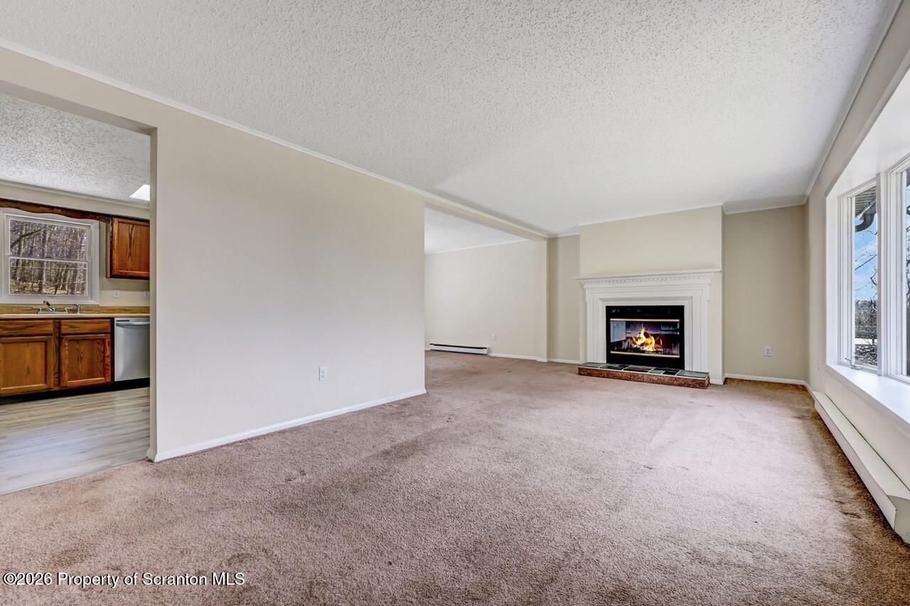 3032 1/2 Division Street Scranton, PA 18504 - Photo 10 of 49 an empty room with furniture and a fireplace