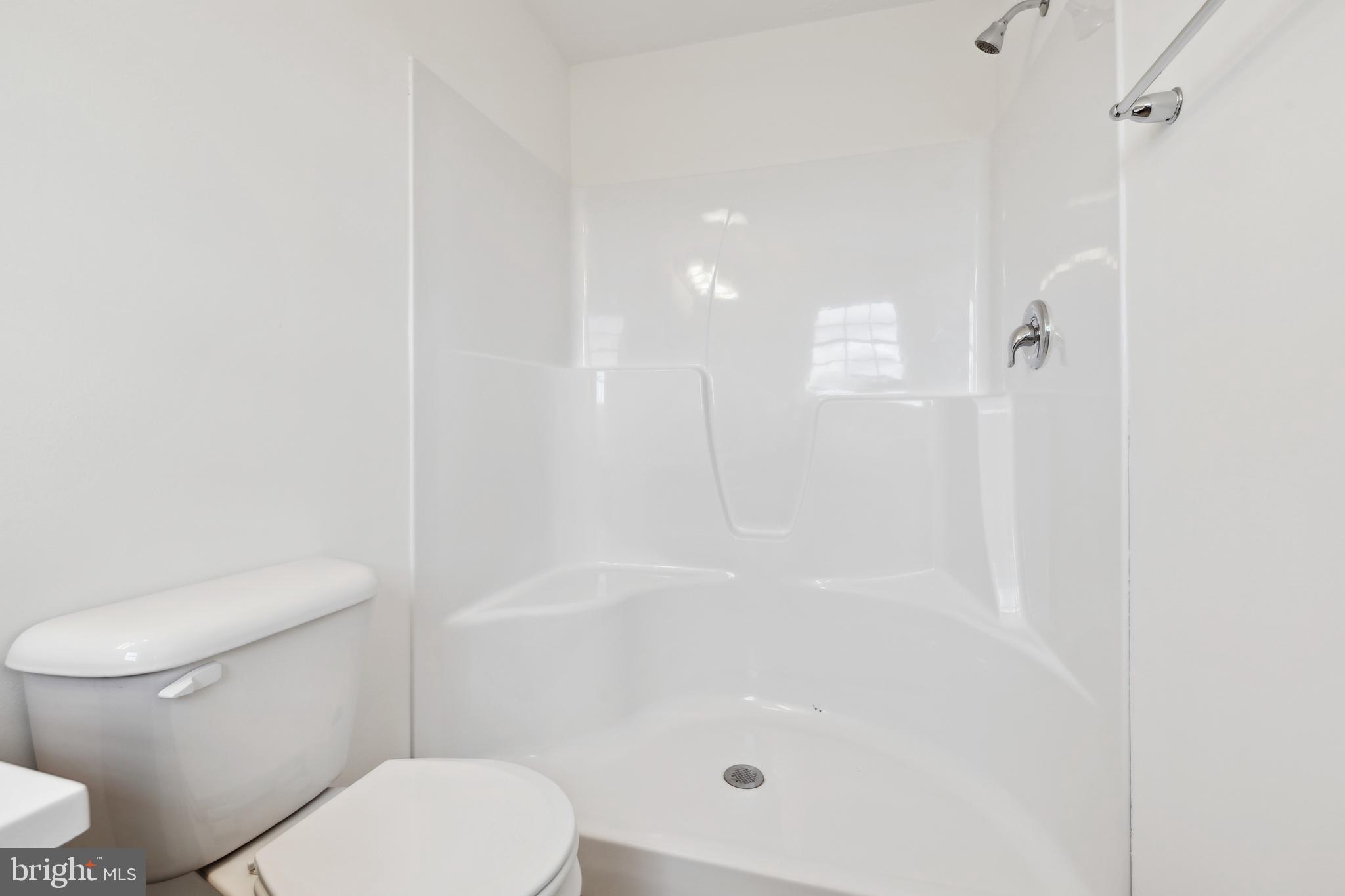 3822 Castle Drive Dover, PA 17315 - Photo 17 of 23 a white toilet sitting next to a bath tub