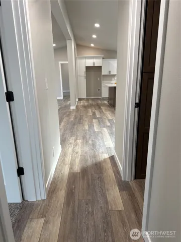 an empty room with windows and closet