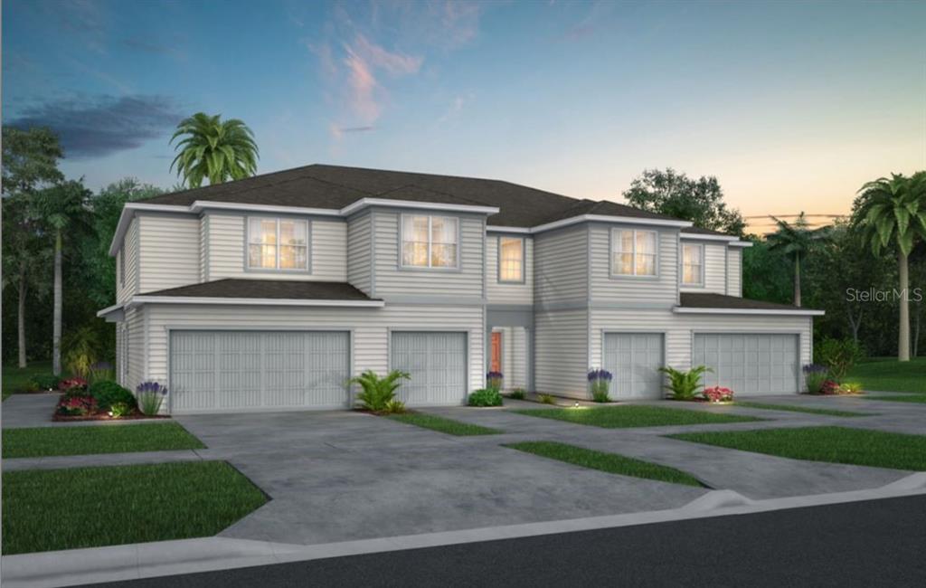 4601 Sparkling Shell Avenue Kissimmee, FL 34746 - Photo 1 of 1 a front view of a house with a garden and plants