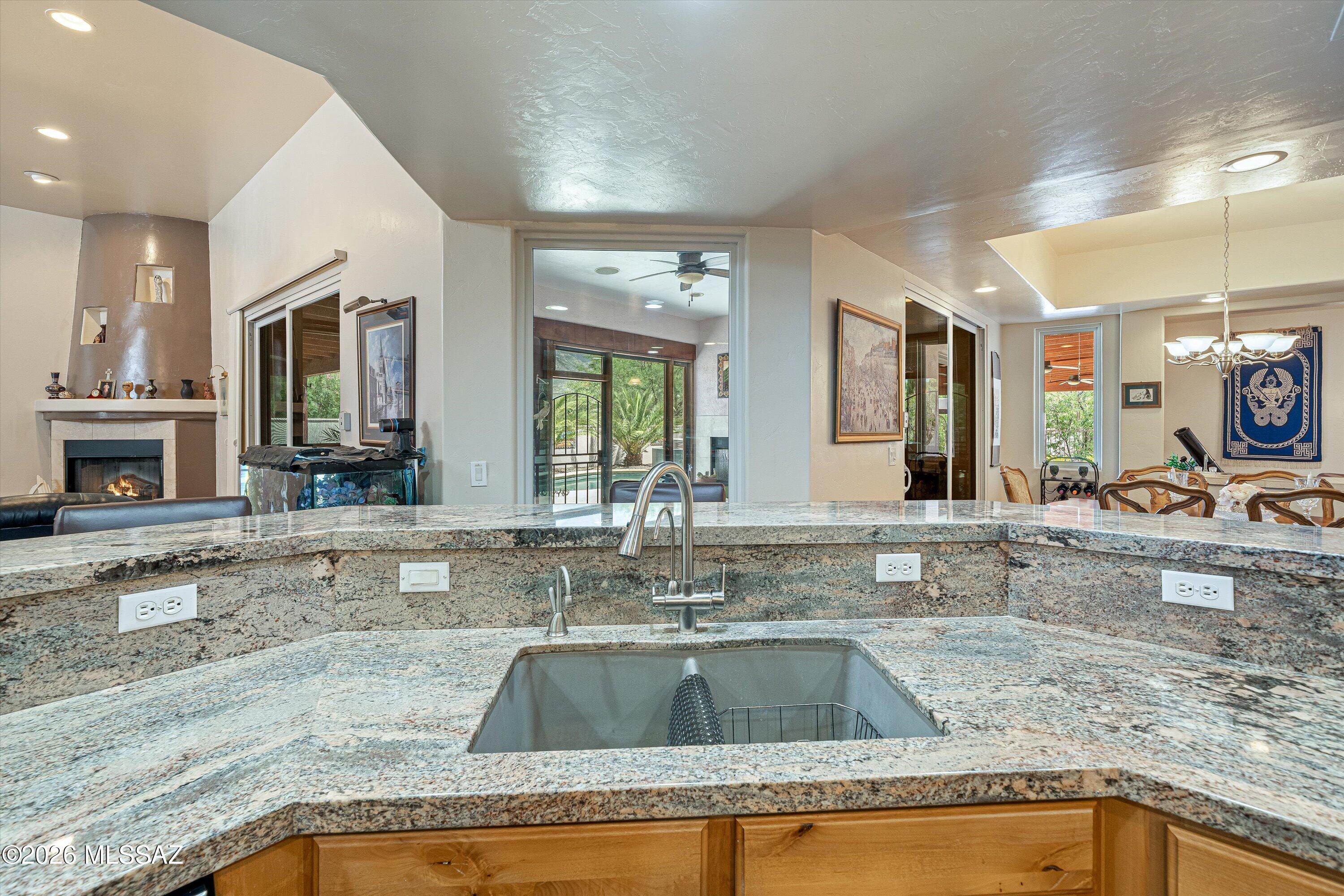 4677 East Rail N Road Tucson, AZ 85739 - Photo 10 of 48 Custom alder cabinets with granite countertops and sit up bar