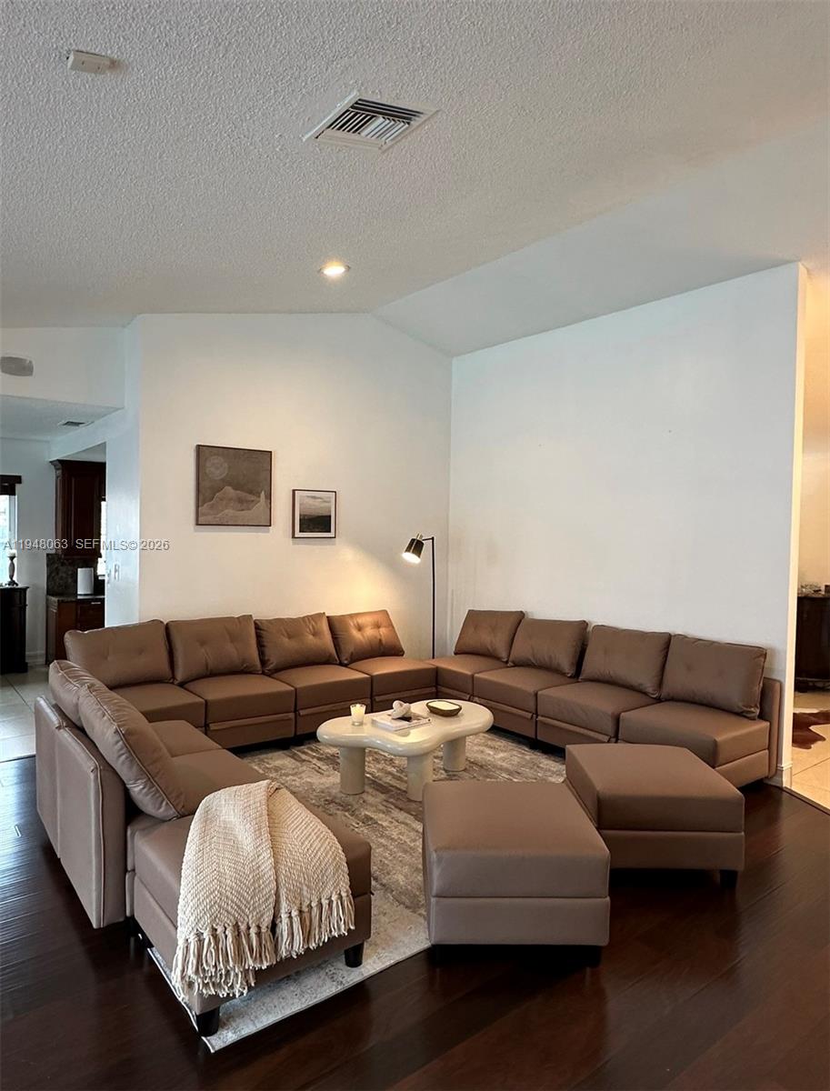 3594 Southwest 69th Avenue Miramar, FL 33023 - Photo 14 of 20 a living room with furniture and a couch