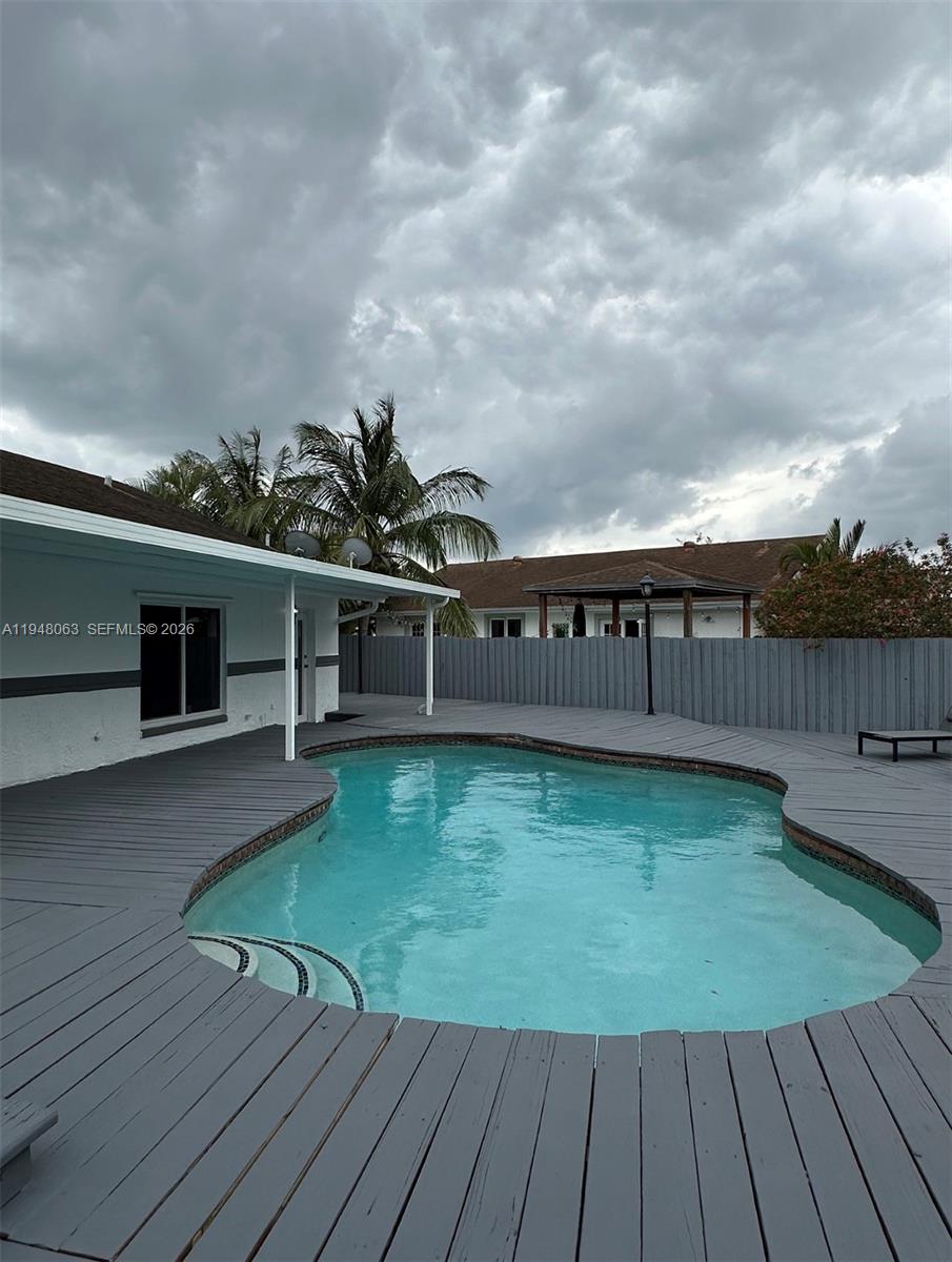 3594 Southwest 69th Avenue Miramar, FL 33023 - Photo 20 of 20 a view of outdoor space with deck and living room