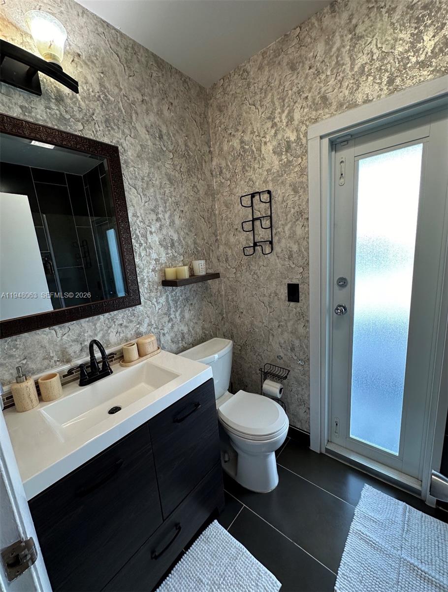 3594 Southwest 69th Avenue Miramar, FL 33023 - Photo 6 of 20 a bathroom with a sink and a mirror