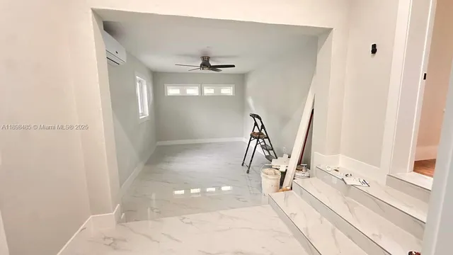 a view of a living room with a fireplace