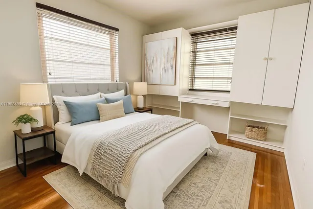 a bedroom with a large bed and a window