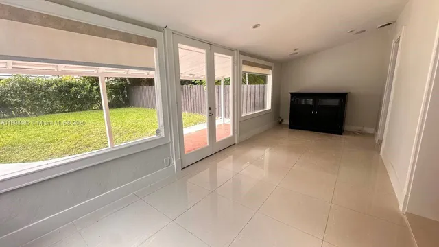 a view of an empty room and window