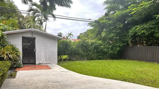 a backyard of a house with lots of green space
