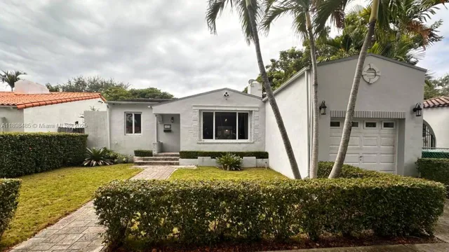 a house view with a garden space