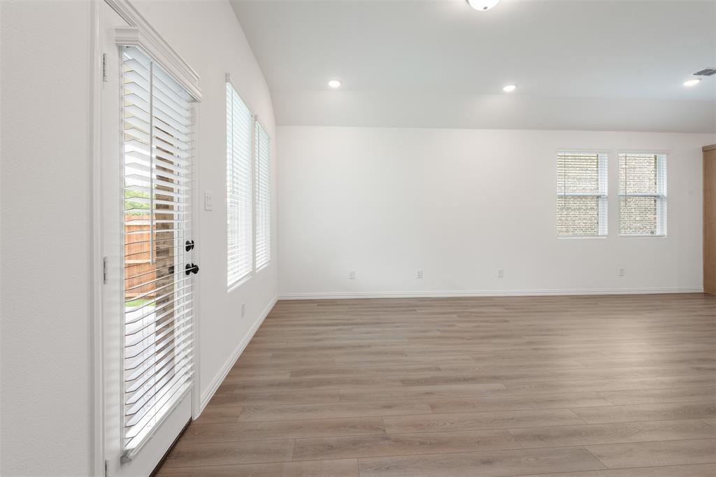 2011 Redtail Drive Melissa, TX 75454 - Photo 12 of 27 a view of a room with wooden floor and a window