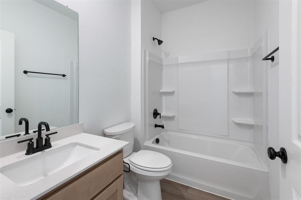 2011 Redtail Drive Melissa, TX 75454 - Photo 15 of 27 a bathroom with a sink toilet and shower