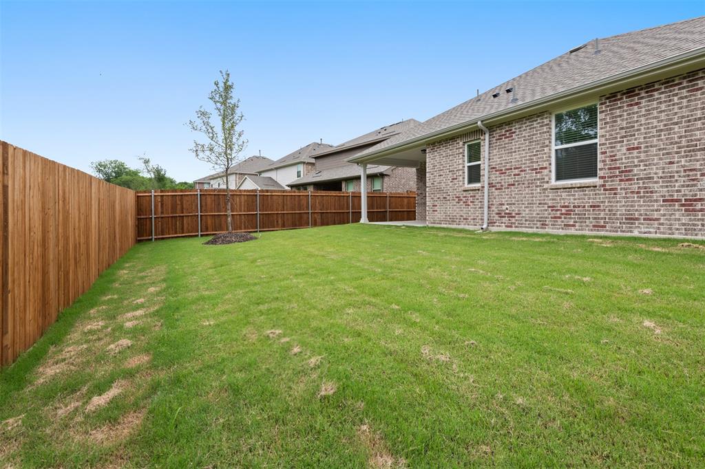 2011 Redtail Drive Melissa, TX 75454 - Photo 25 of 27 a backyard of a house with lots of green space