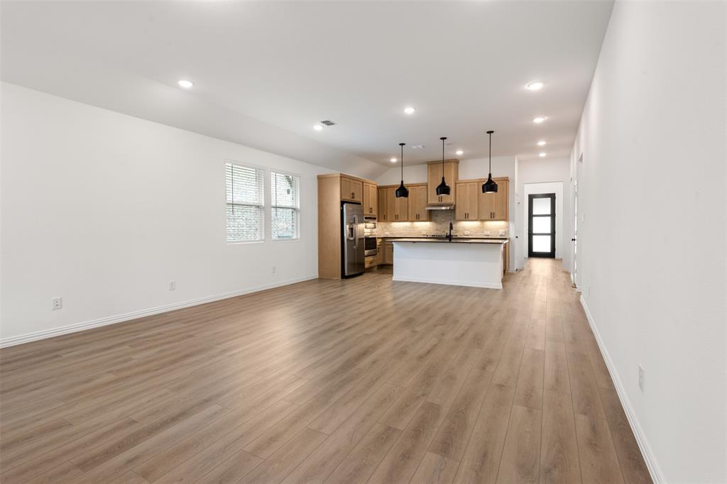 2011 Redtail Drive Melissa, TX 75454 - Photo 5 of 27 a view of kitchen dining table chairs cabinets and wooden floor