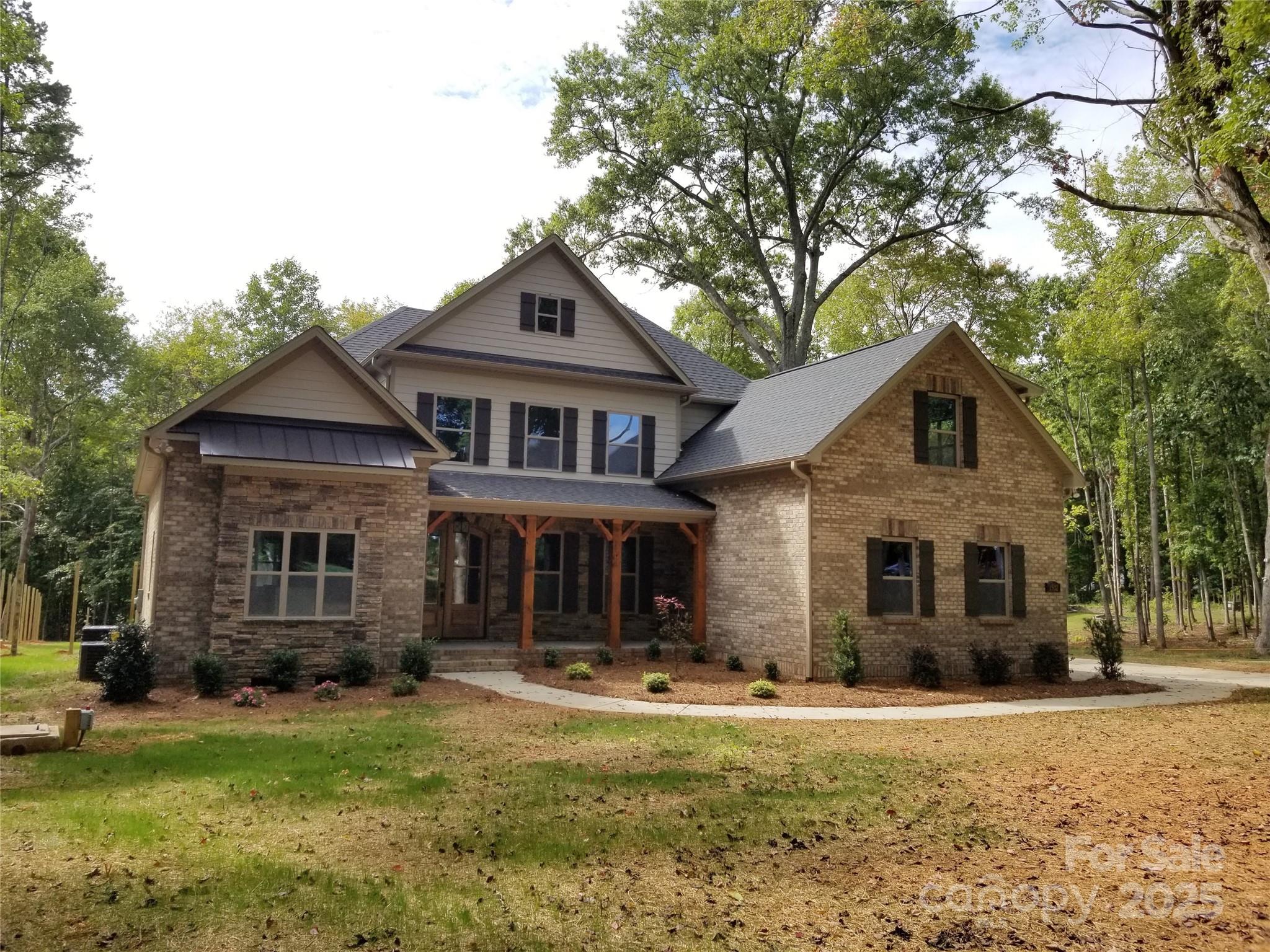6507 Rehobeth Road, Unit 4 Waxhaw, NC 28173 - Photo 5 of 10 front view of a house with a yard