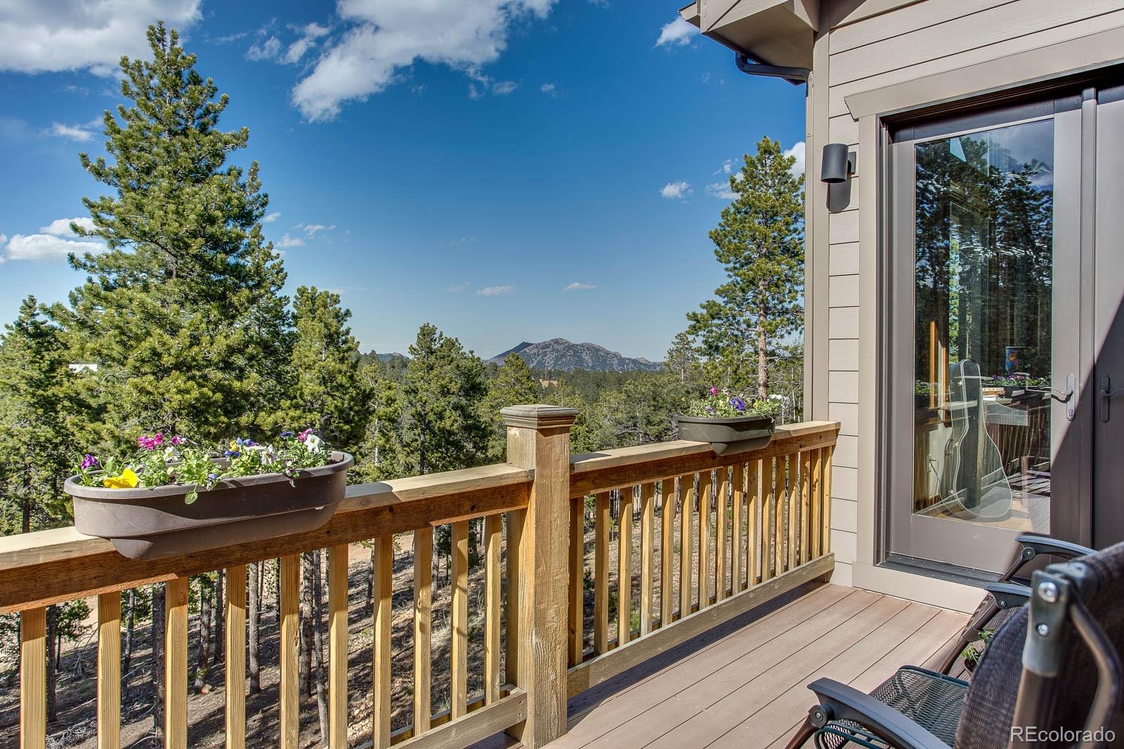 398 Crescent Lake Road Golden, CO 80403 - Photo 16 of 25 a view of a balcony with wooden floor