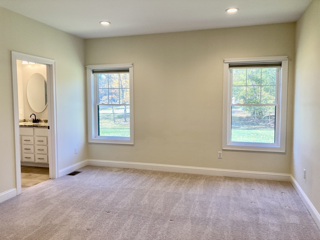 28 Spring Street Petersham, MA 01366 - Photo 13 of 31 an empty room with windows cabinet and fireplace