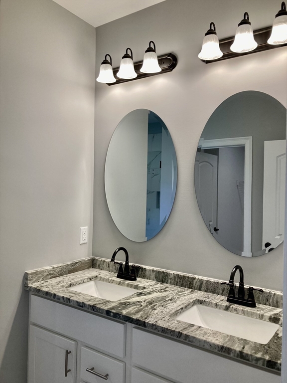 28 Spring Street Petersham, MA 01366 - Photo 14 of 31 a bathroom with a granite countertop double vanity sinks and a mirror