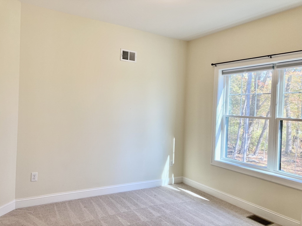 28 Spring Street Petersham, MA 01366 - Photo 16 of 31 an empty room with wooden floor and windows