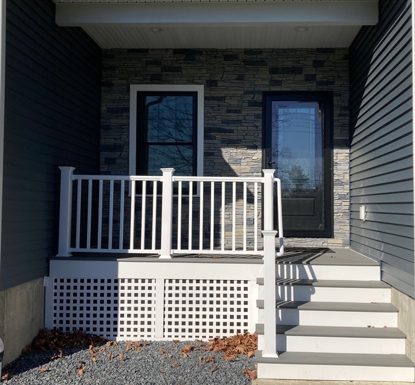 28 Spring Street Petersham, MA 01366 - Photo 3 of 31 a view of a brick house with wooden floor