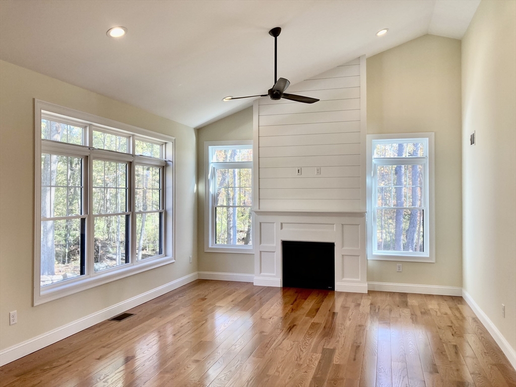 28 Spring Street Petersham, MA 01366 - Photo 7 of 31 a view of empty room with wooden floor and fireplace