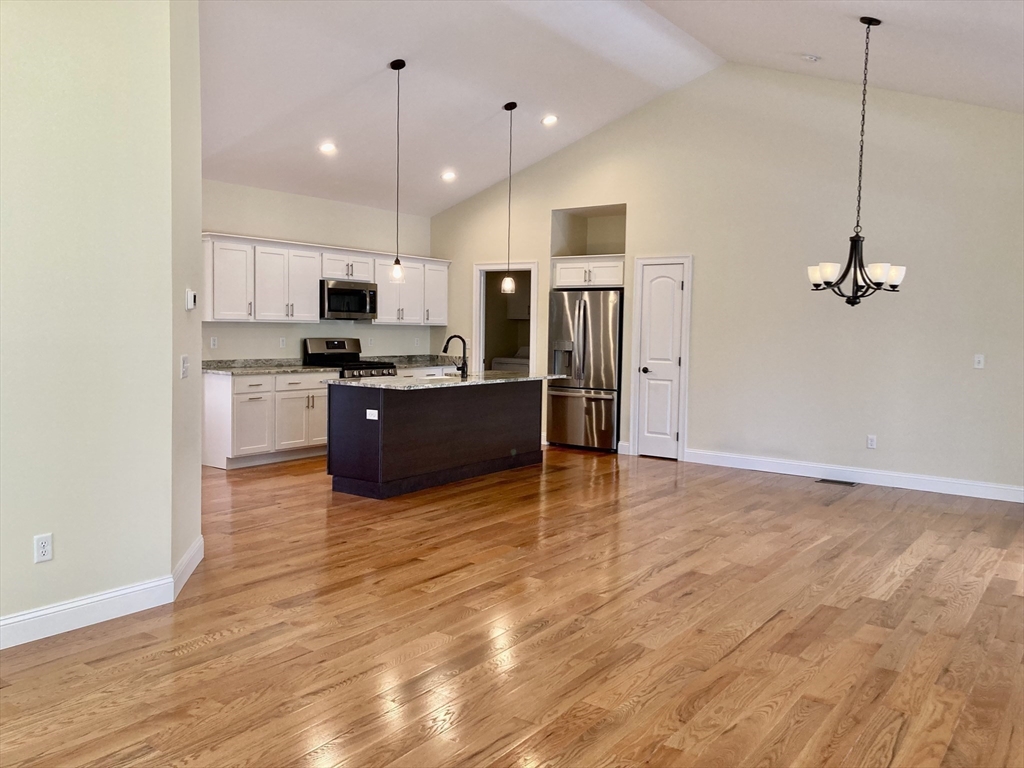 28 Spring Street Petersham, MA 01366 - Photo 8 of 31 a kitchen with stainless steel appliances a refrigerator and a stove top oven