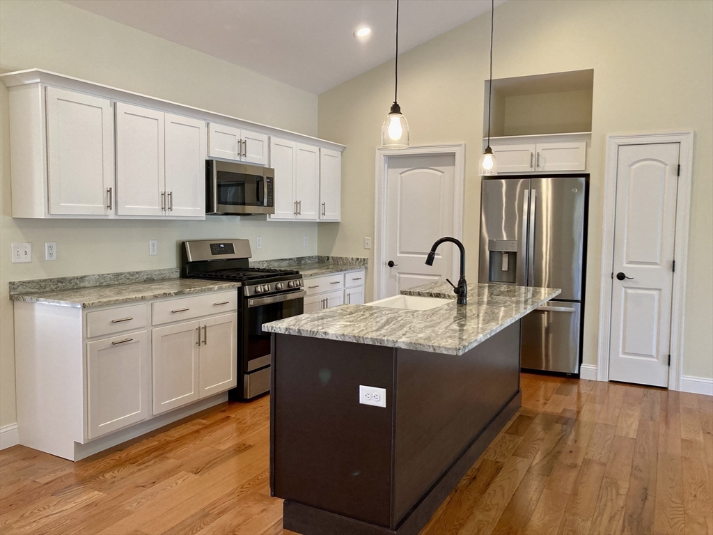 28 Spring Street Petersham, MA 01366 - Photo 10 of 31 a kitchen with stainless steel appliances granite countertop a sink stove and refrigerator