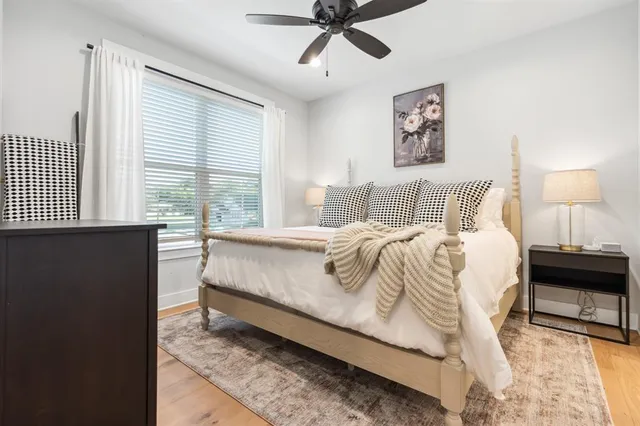 a bed sitting in a bedroom next to a window