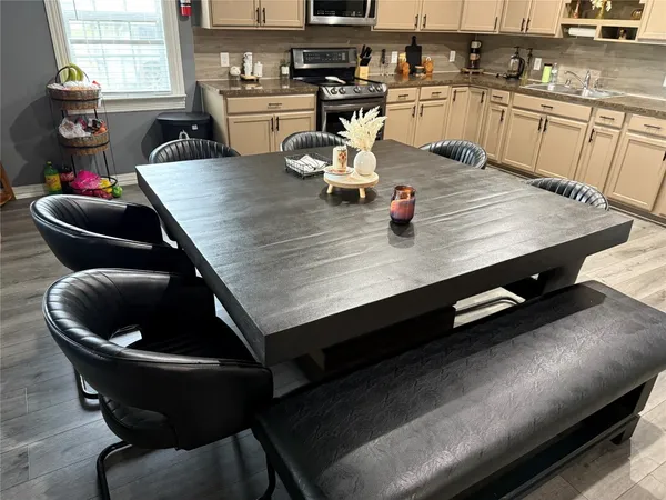 a view of a chairs and table in patio