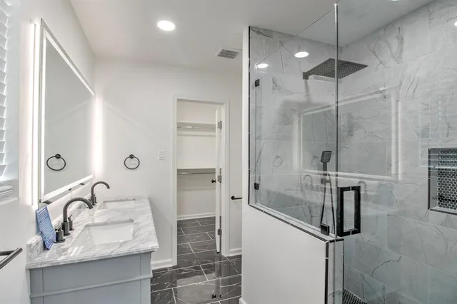 a bathroom with a sink and mirror