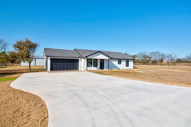 a house with yard in front of it