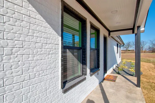 a balcony with view of an outdoor space