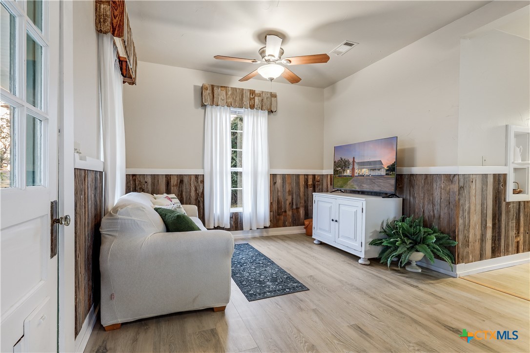 13471 Cedar Valley Road Salado, TX 76571 - Photo 29 of 39 a living room with furniture and wooden floor