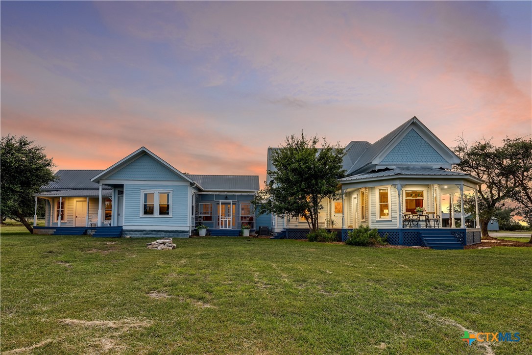 13471 Cedar Valley Road Salado, TX 76571 - Photo 3 of 39 a front view of a house with a garden and plants