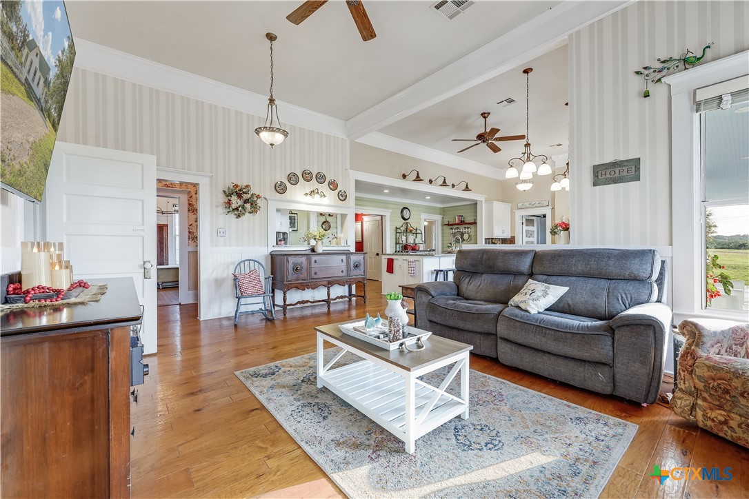 13471 Cedar Valley Road Salado, TX 76571 - Photo 5 of 39 a living room with furniture and kitchen view