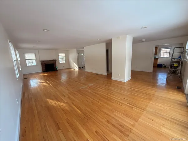 a view of a livingroom with wooden floor