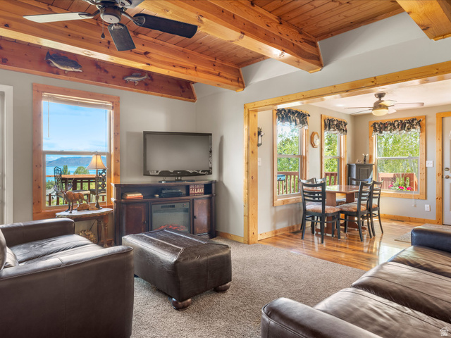 371 Lewis Loop, Unit 29 Fish Haven, ID 83287 - Photo 17 of 40 Living area featuring exposed wood beam ceilings and a scenic water backdrop