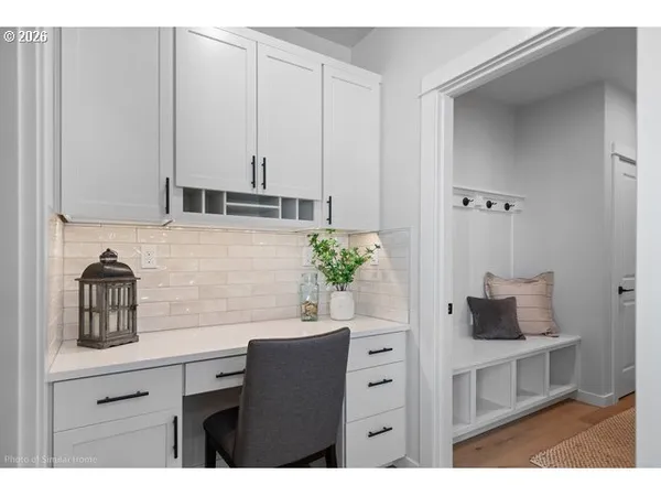 a kitchen with a refrigerator and cabinets