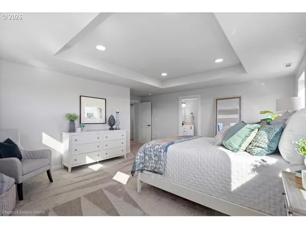 a bedroom with a bed and a couch