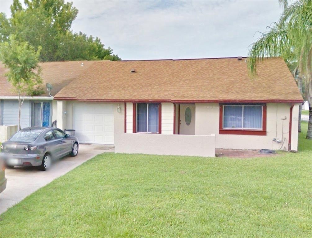 101 Oakridge Court Sanford, FL 32773 - Photo 1 of 1 a front view of a house with a garden and yard
