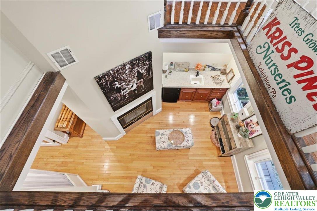 3585 Fairyland Road Lehighton, PA 18235 - Photo 30 of 57 Hardwood floors and a cozy fireplace create a warm, inviting living space.