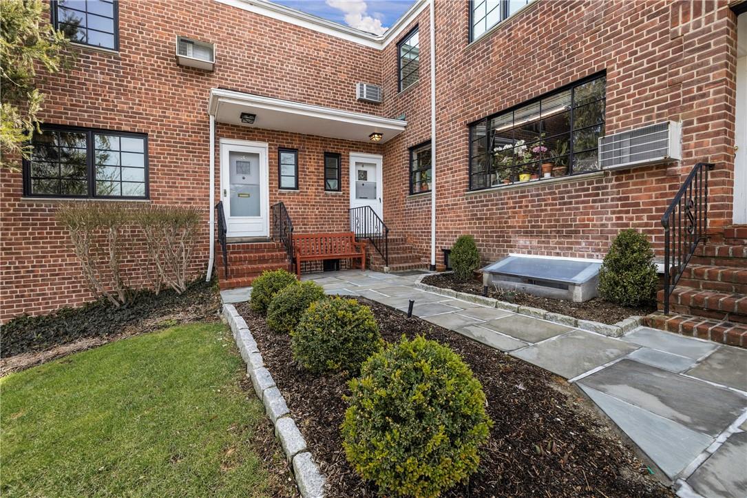181 Purchase Street, Unit 4 Rye, NY 10580 - Photo 1 of 1 a view of a house with backyard sitting area and garden