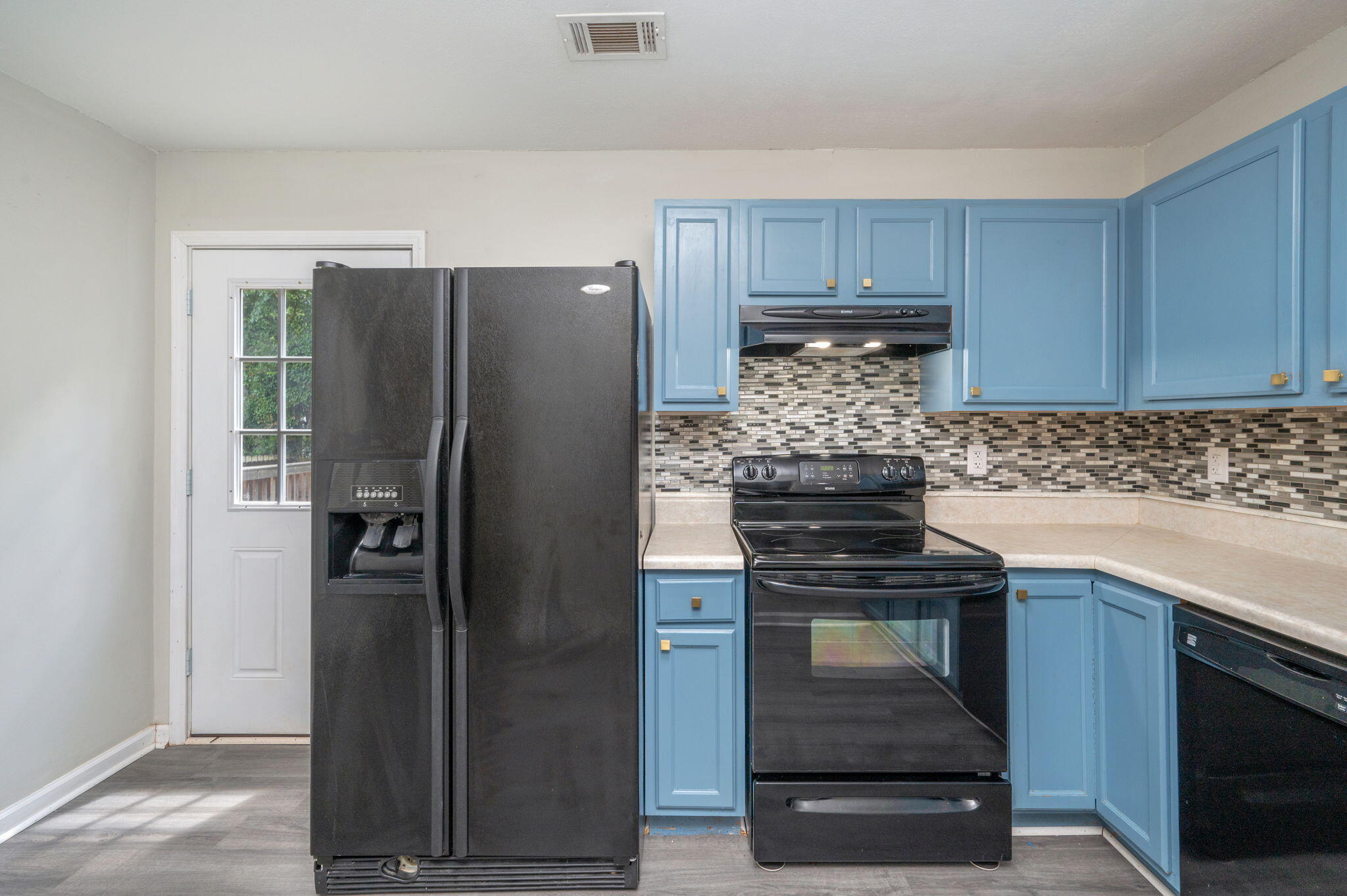 242 Wainwright Drive Crestview, FL 32539 - Photo 13 of 43 a kitchen with a stove and a refrigerator