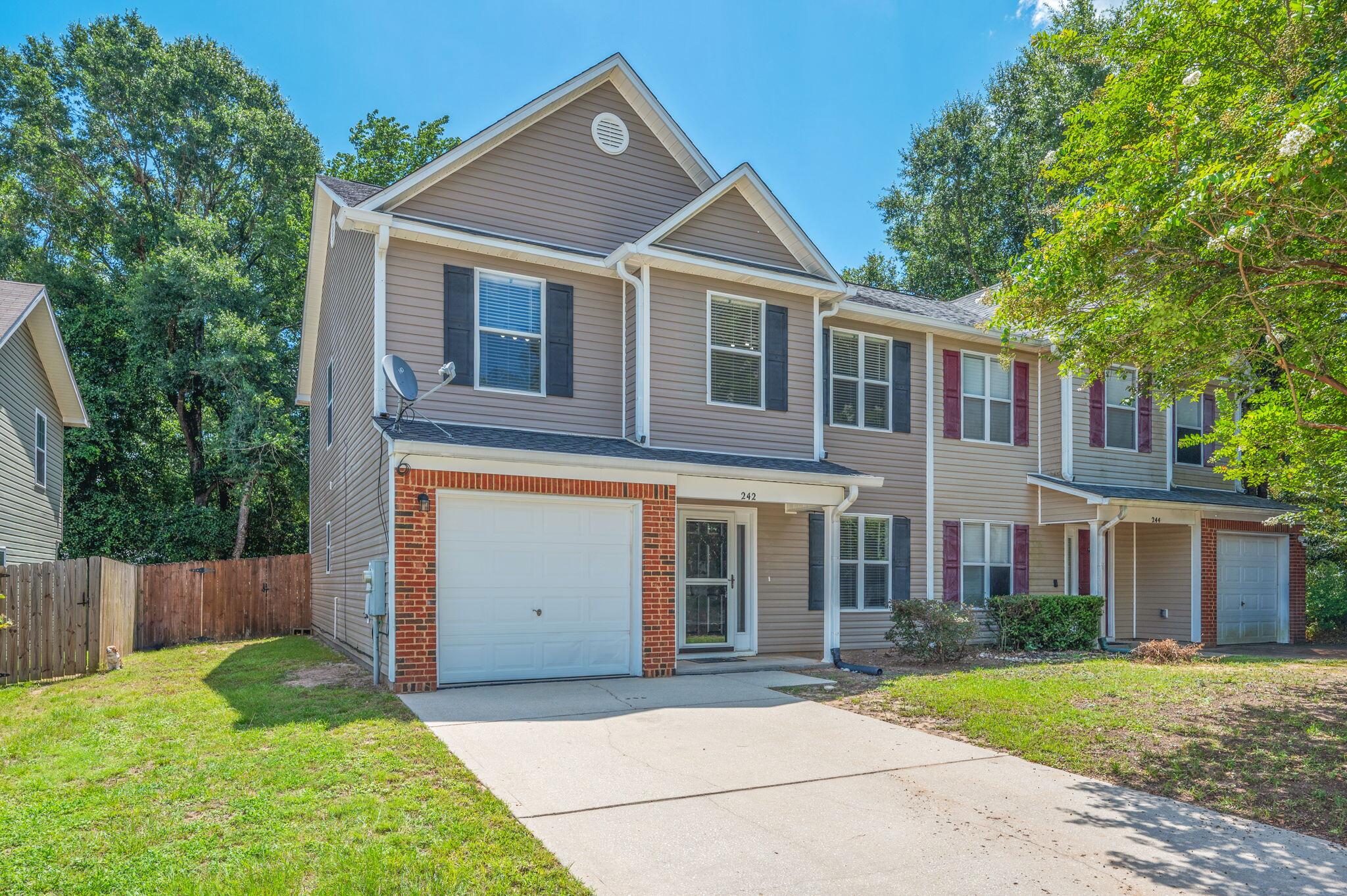 242 Wainwright Drive Crestview, FL 32539 - Photo 2 of 43 a front view of a house with a yard