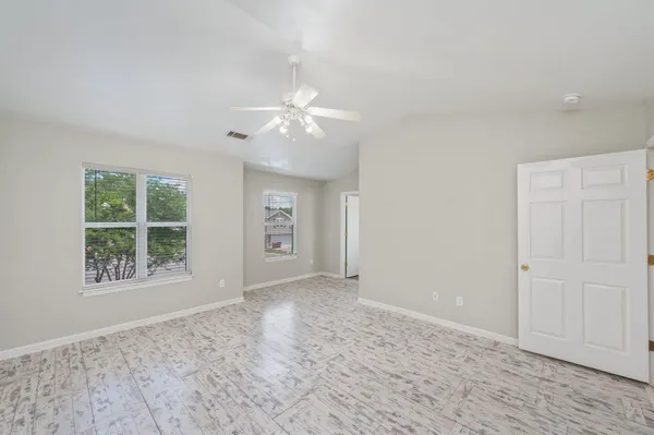 a view of an empty room with a window