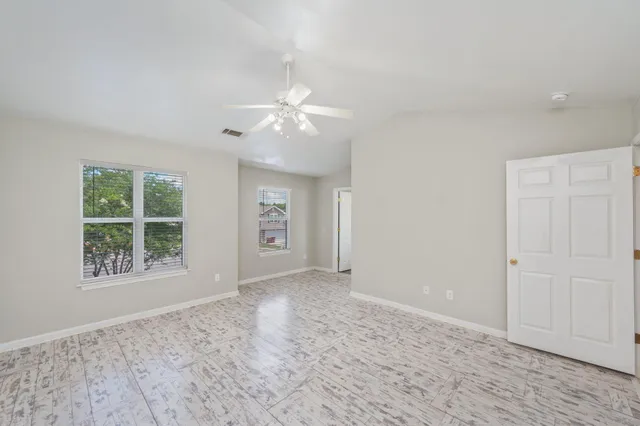 a view of an empty room with a window