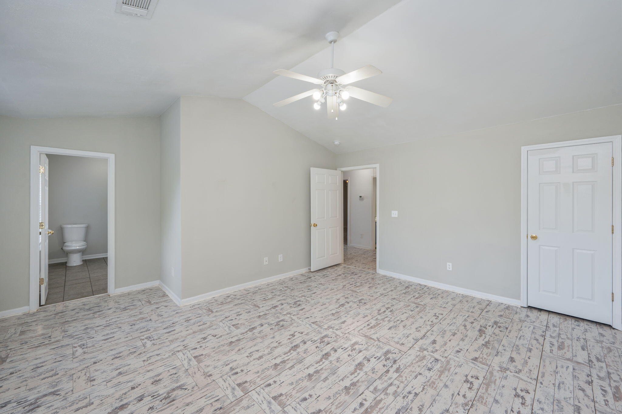 242 Wainwright Drive Crestview, FL 32539 - Photo 23 of 43 a view of an empty room with a chandelier fan